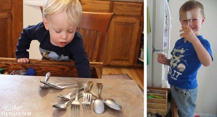 Young children demonstrating responsibility by sorting silverware, a step towards mastering kitchen tasks.